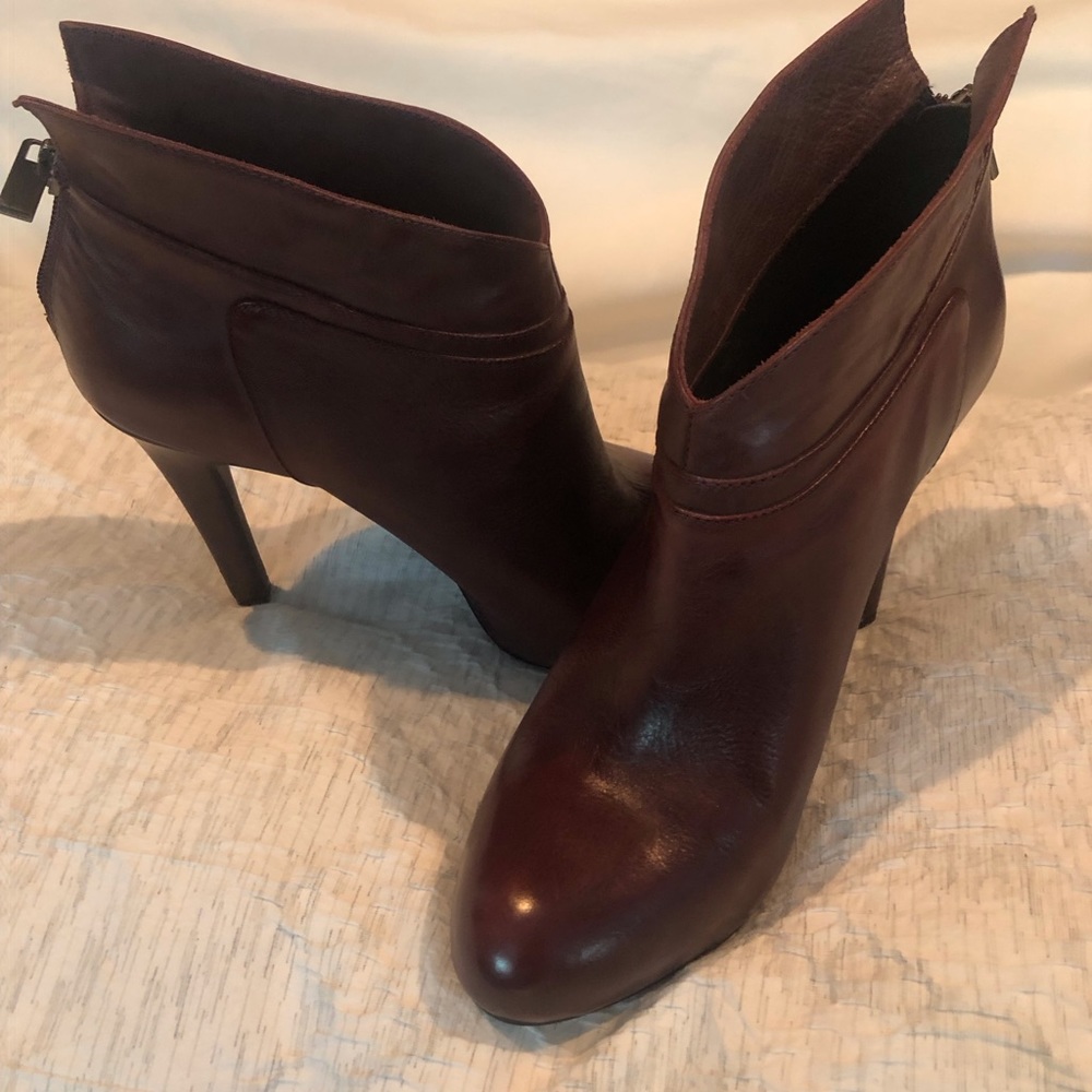 Burgundy  colored leather Jessica Simpson 4 3/4” heeled bootie. Size 8